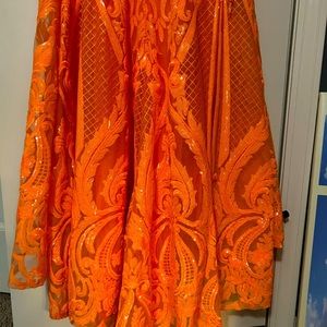 Orange prom dress size 0.  Has a hook to bustle the short train.